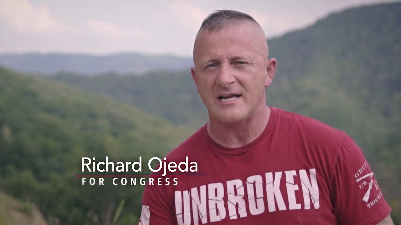 Richard Ojeda wearing a red "Unbroken" t-shirt.